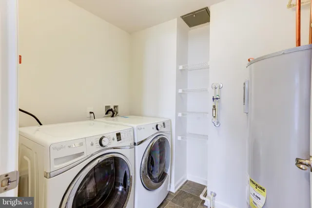 a view of storage and utility room with washer and dryer