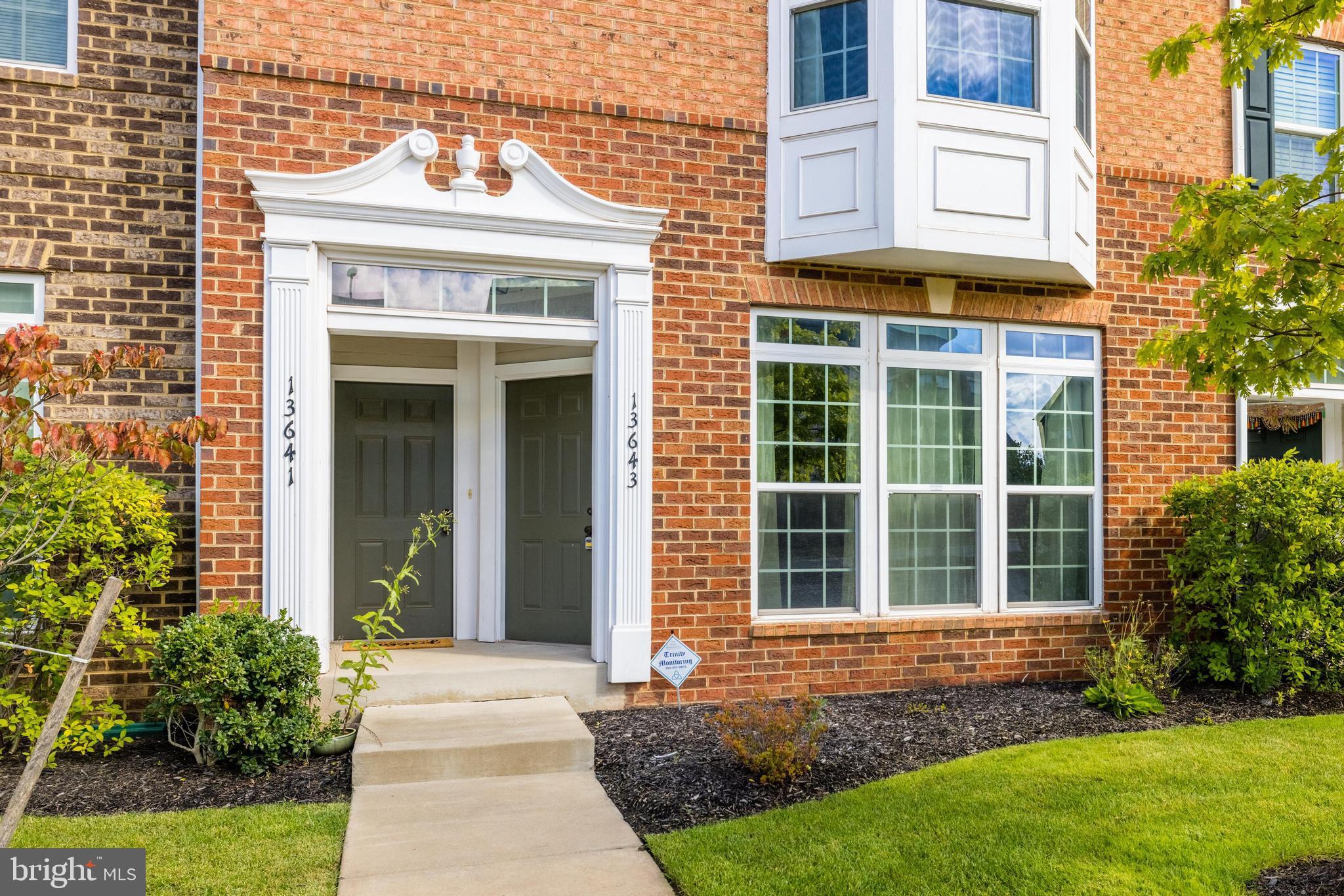 13643 Air And Parkway, Unit MUSEUM 9L Herndon, VA 20171 - Photo 3 of 45 a front view of a house with garden
