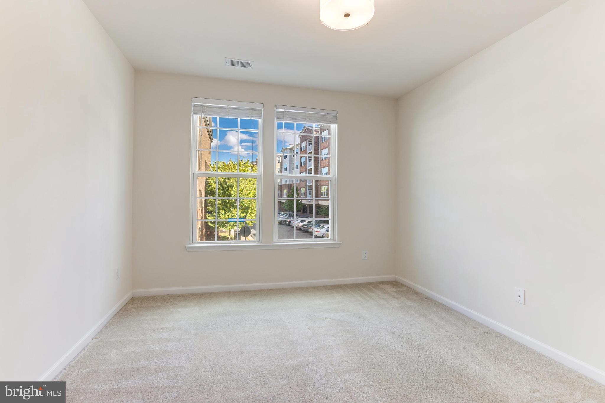 13643 Air And Parkway, Unit MUSEUM 9L Herndon, VA 20171 - Photo 31 of 45 an empty room with a window