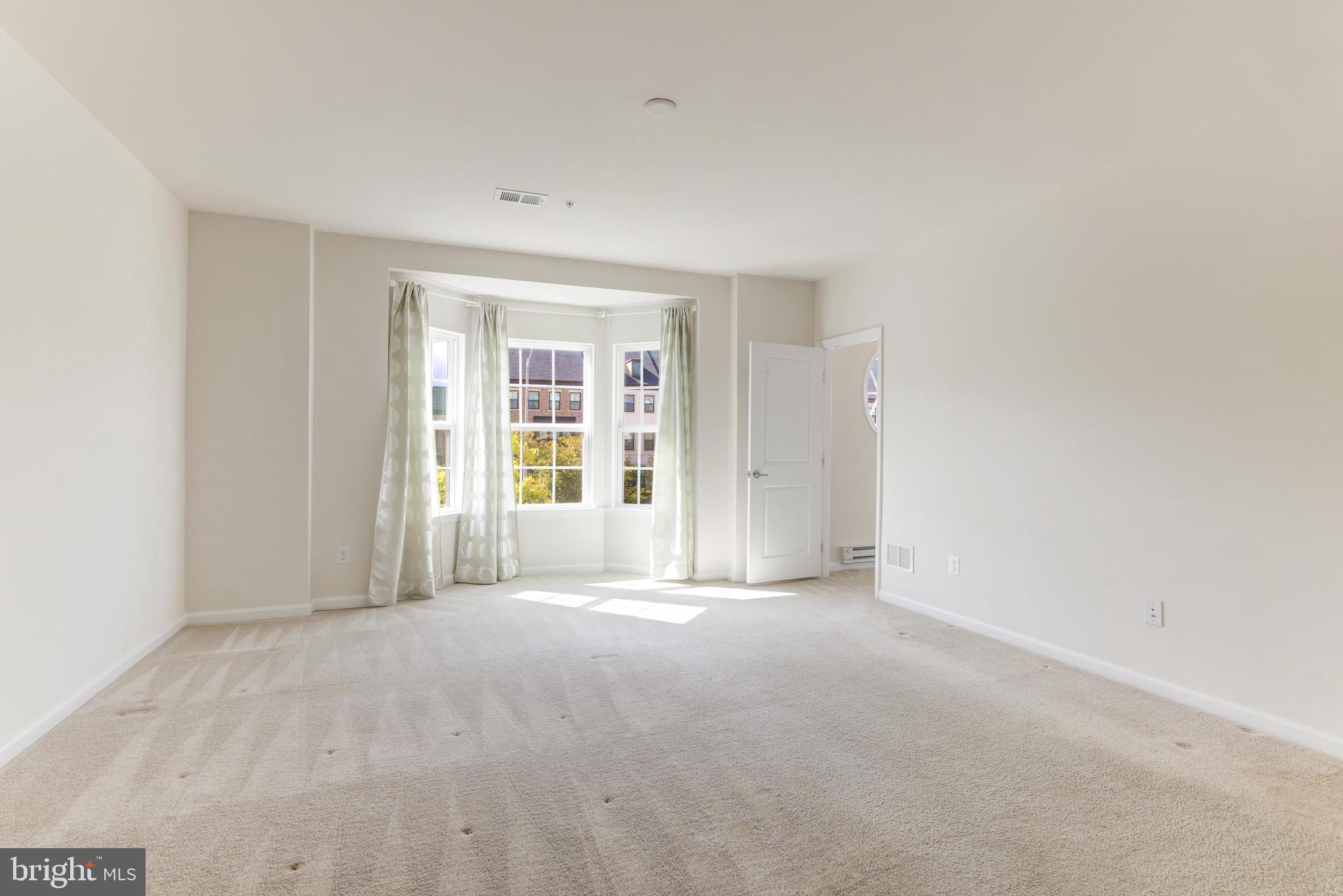 13643 Air And Parkway, Unit MUSEUM 9L Herndon, VA 20171 - Photo 34 of 45 a view of an empty room with a window