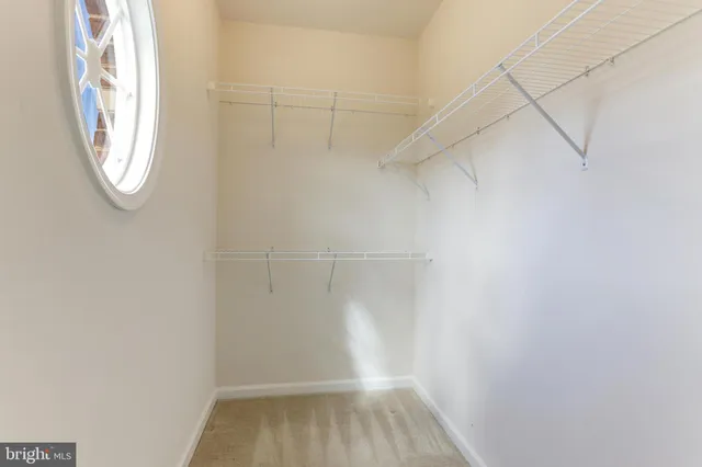 a view of a small space with racks on the wall