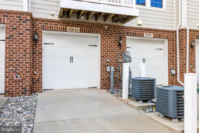 a front view of a house with a garage