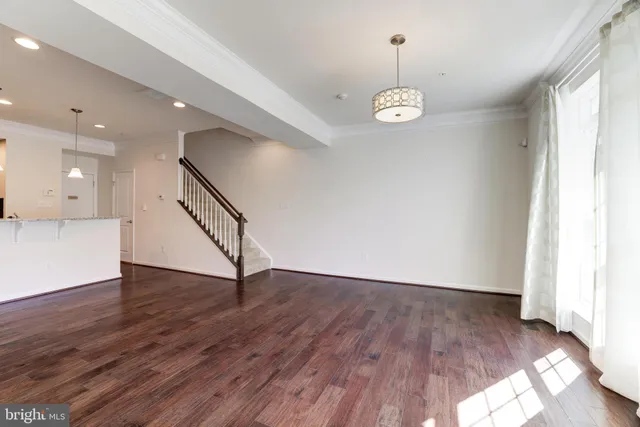 a view of an entryway with wooden floor