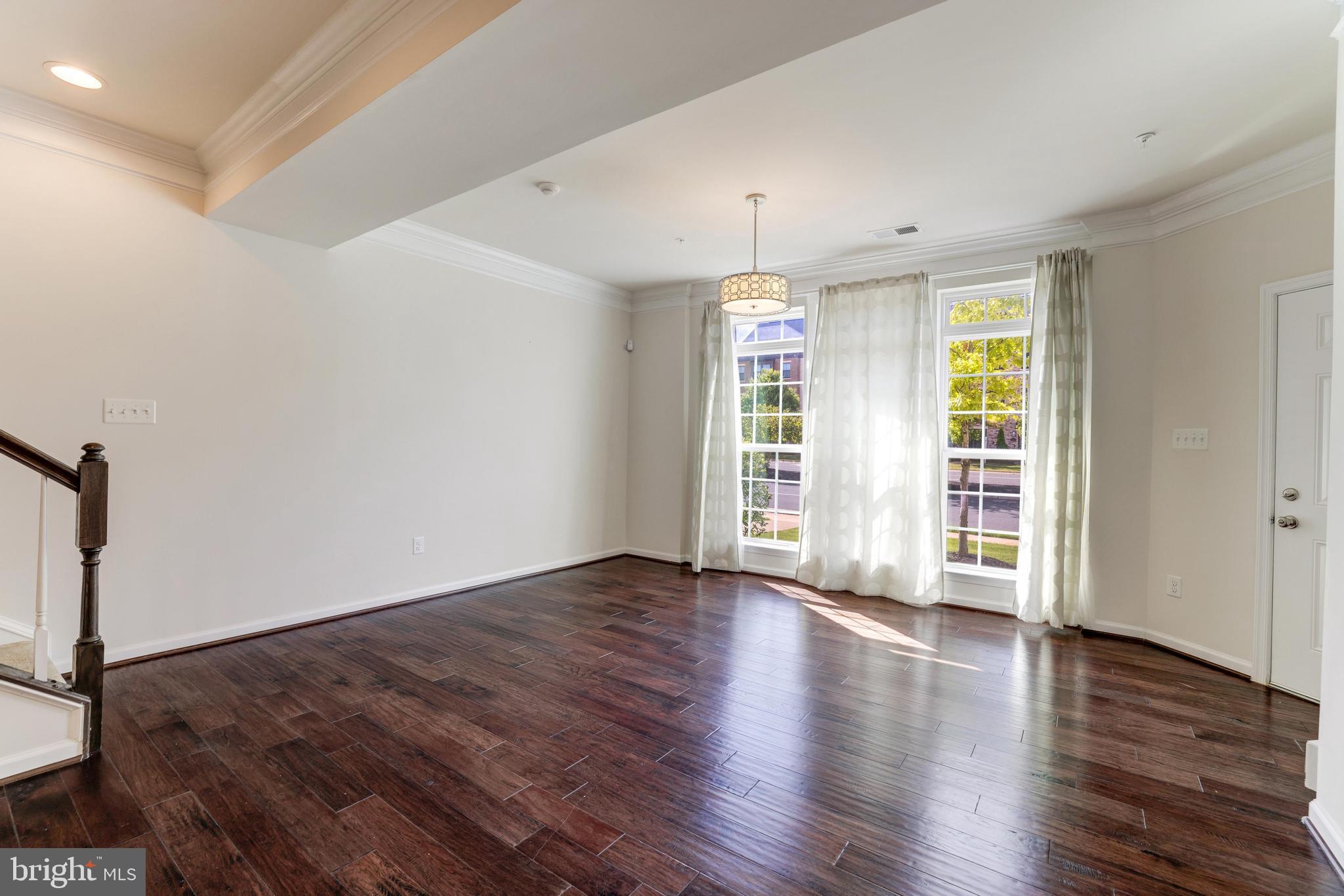 13643 Air And Parkway, Unit MUSEUM 9L Herndon, VA 20171 - Photo 6 of 45 an empty room with wooden floor and a window