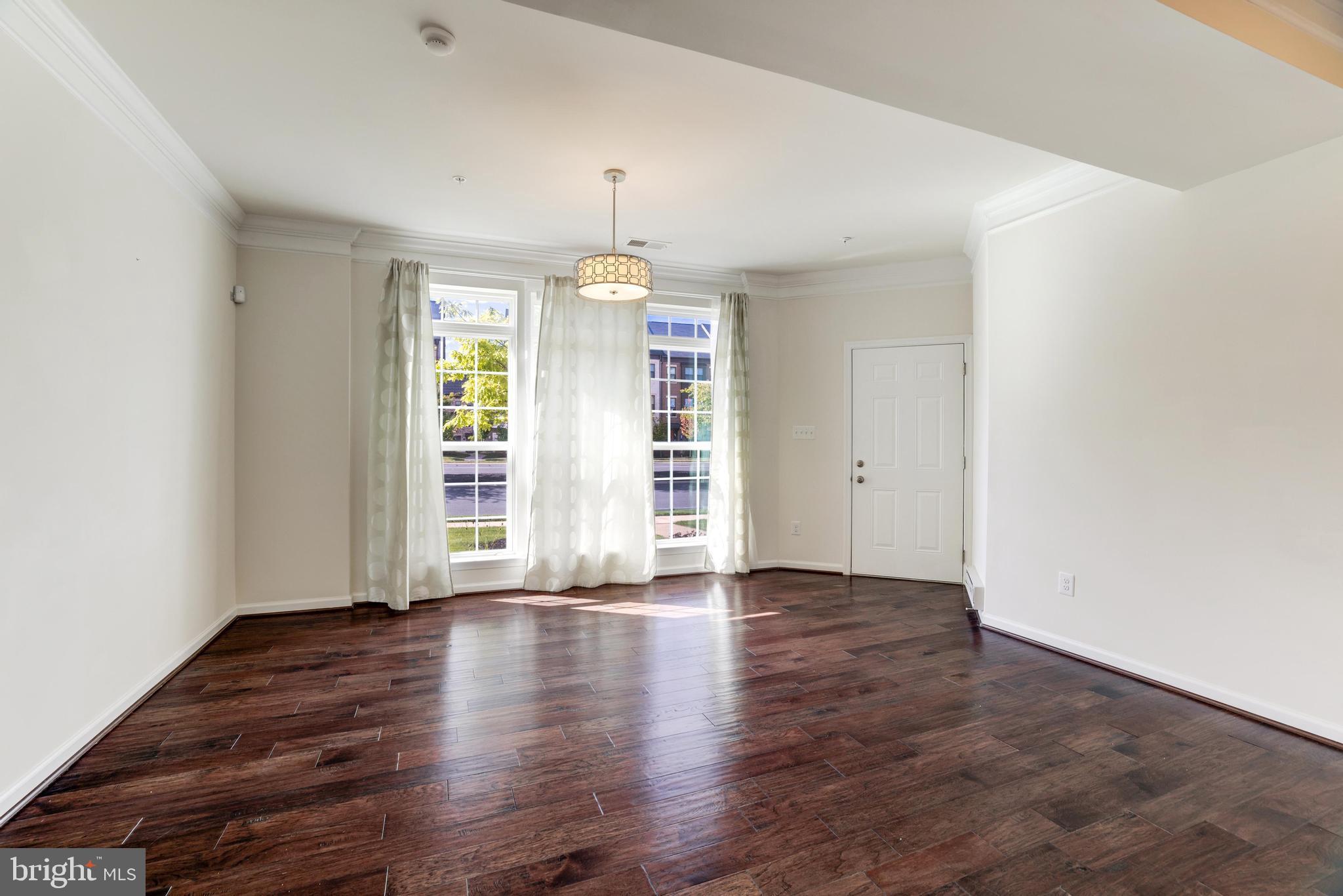13643 Air And Parkway, Unit MUSEUM 9L Herndon, VA 20171 - Photo 8 of 45 an empty room with wooden floor and window