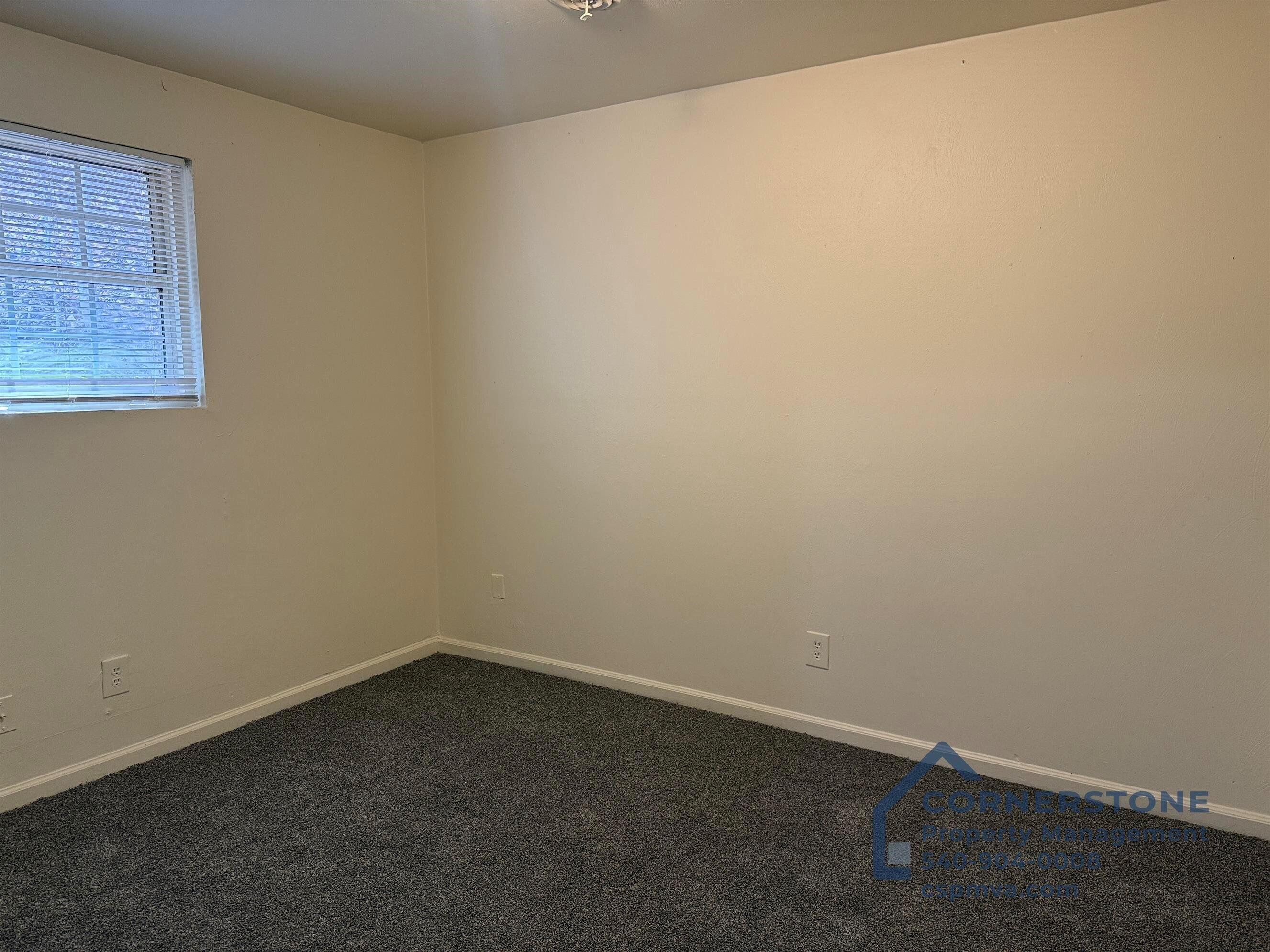 6700 Shingle Rdg Road, Unit 8B Roanoke, VA 24018 - Photo 8 of 13 an empty room with a window