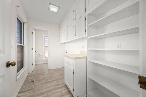 a view of an empty room with a ceiling fan