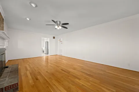 a view of a house with a backyard and balcony