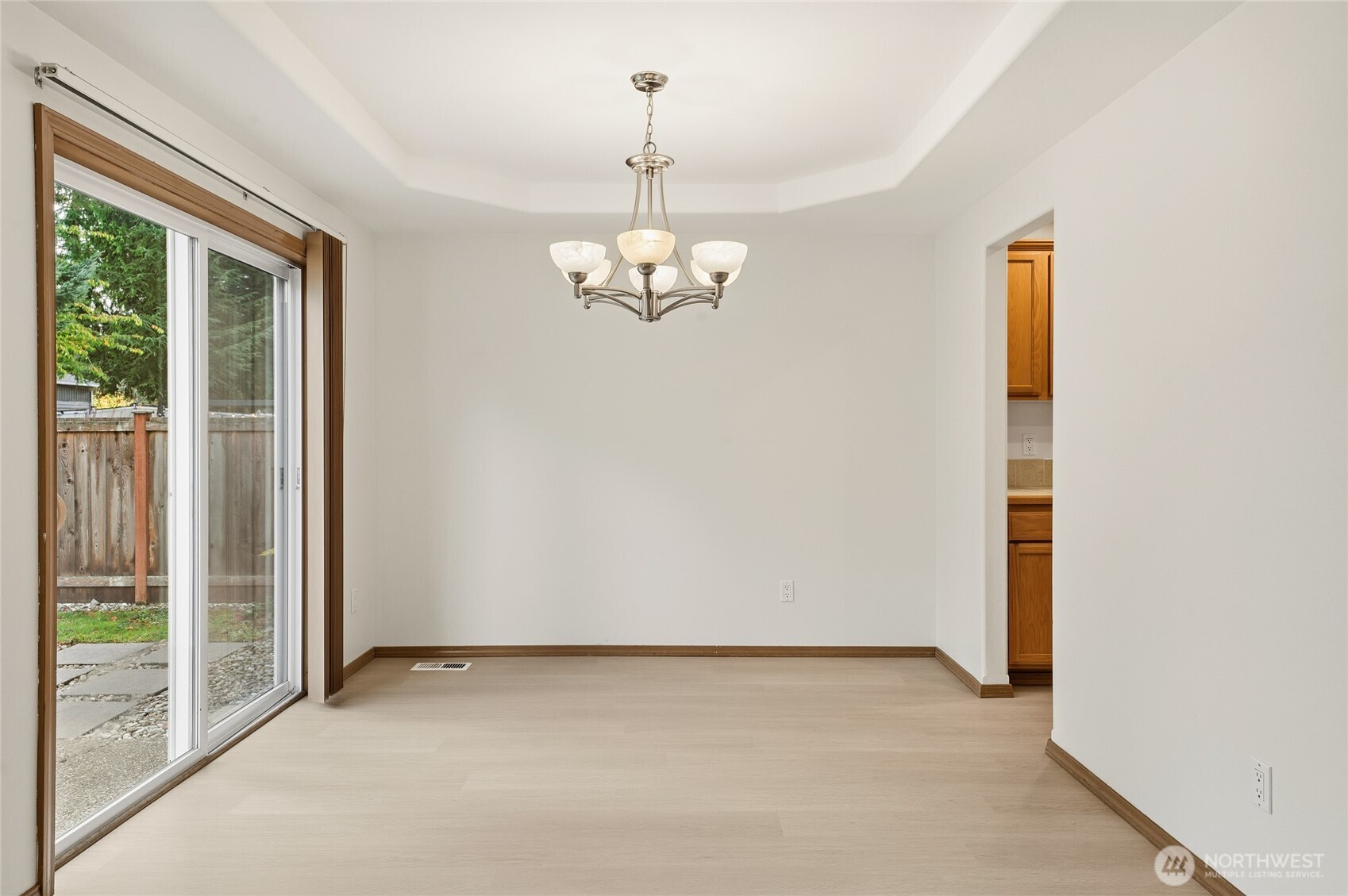 14019 52nd Avenue West, Unit B Edmonds, WA 98026 - Photo 13 of 38 a view of a hallway with windows and chandelier