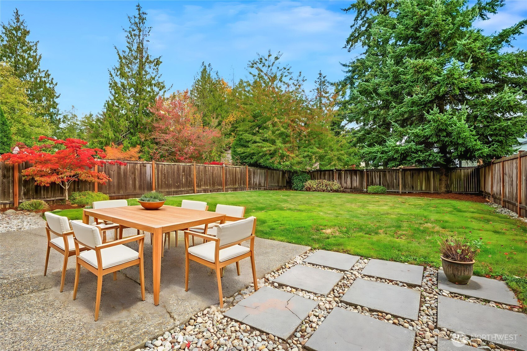14019 52nd Avenue West, Unit B Edmonds, WA 98026 - Photo 2 of 38 a table and chairs in the garden