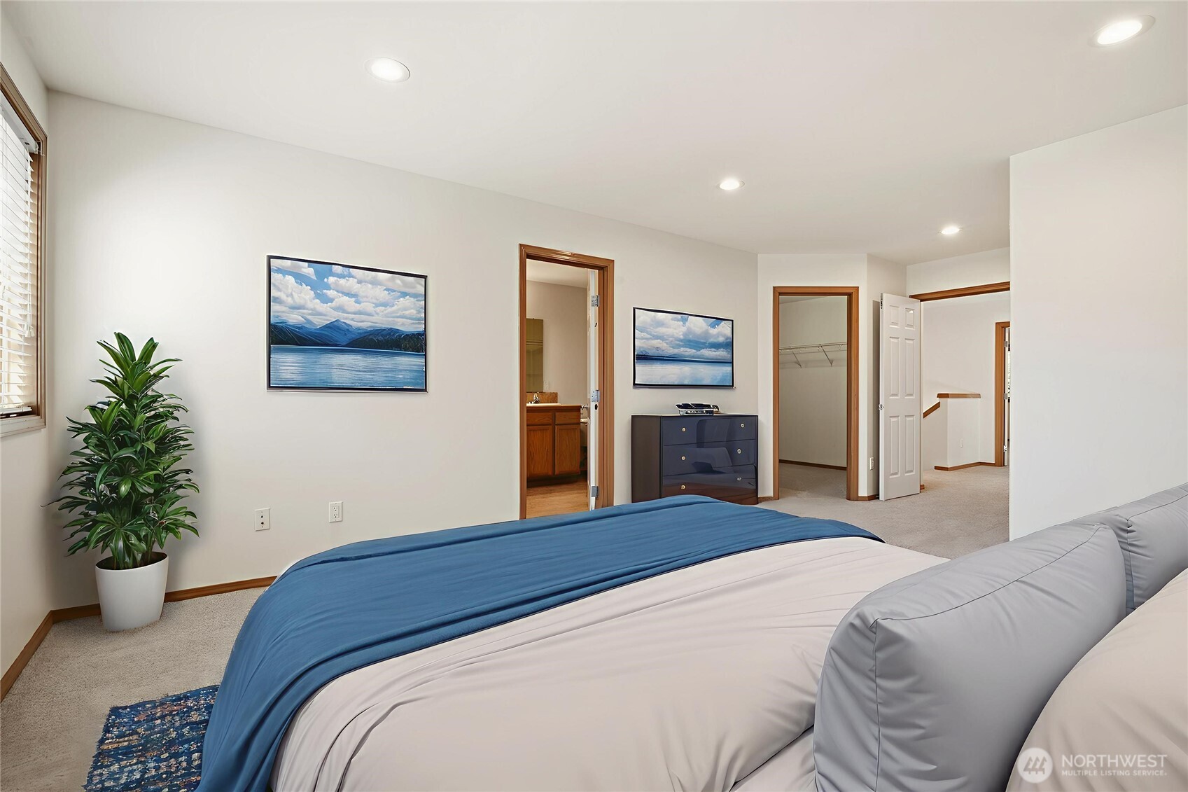 14019 52nd Avenue West, Unit B Edmonds, WA 98026 - Photo 21 of 38 a bedroom with a large bed and potted plant