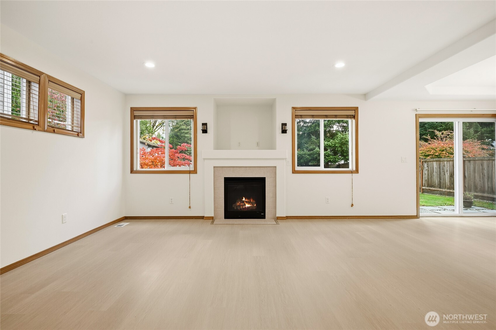 14019 52nd Avenue West, Unit B Edmonds, WA 98026 - Photo 10 of 38 a view of an empty room with a fireplace and a window