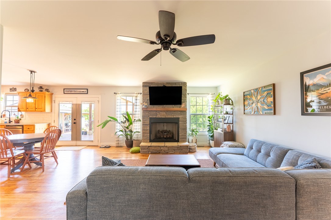 696 Mt Olivet Road Six Mile, SC 29682 - Photo 5 of 35 This inviting space features a cozy fireplace, hardwood floors, and abundant natural light.