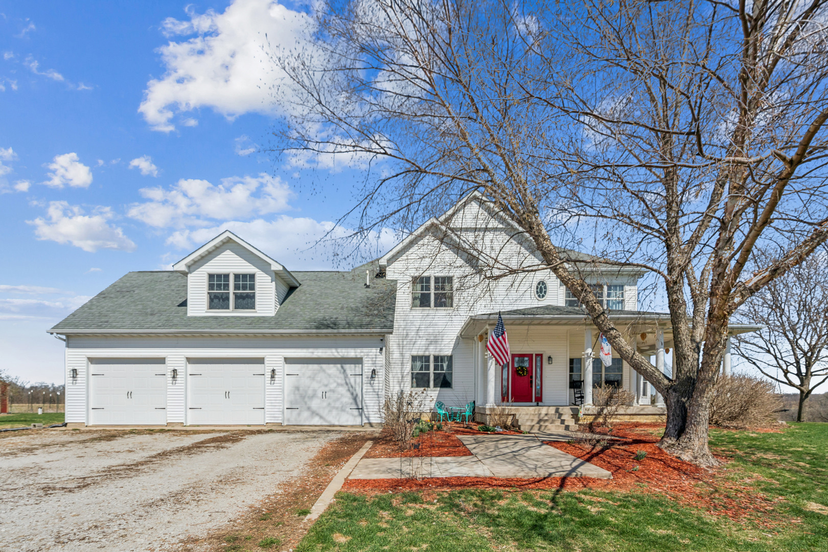 3203 148th Avenue Milan, IL 61264 - Photo 1 of 65 a front view of a house with a yard