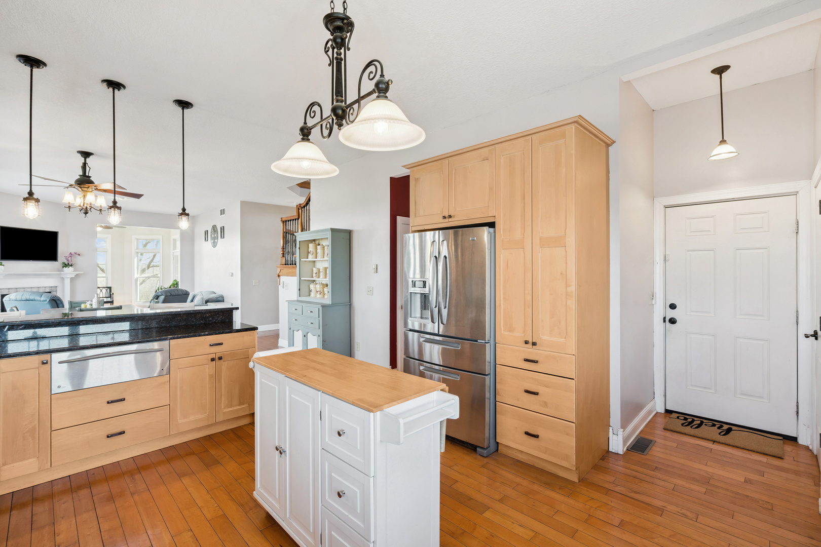 3203 148th Avenue Milan, IL 61264 - Photo 11 of 65 a kitchen with white cabinets and stainless steel appliances