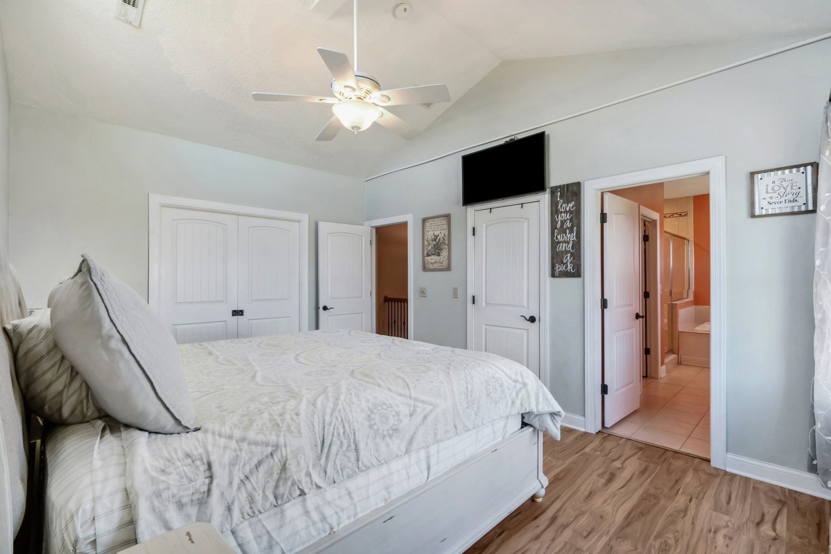 3203 148th Avenue Milan, IL 61264 - Photo 19 of 65 a spacious bedroom with a bed and a flat screen tv