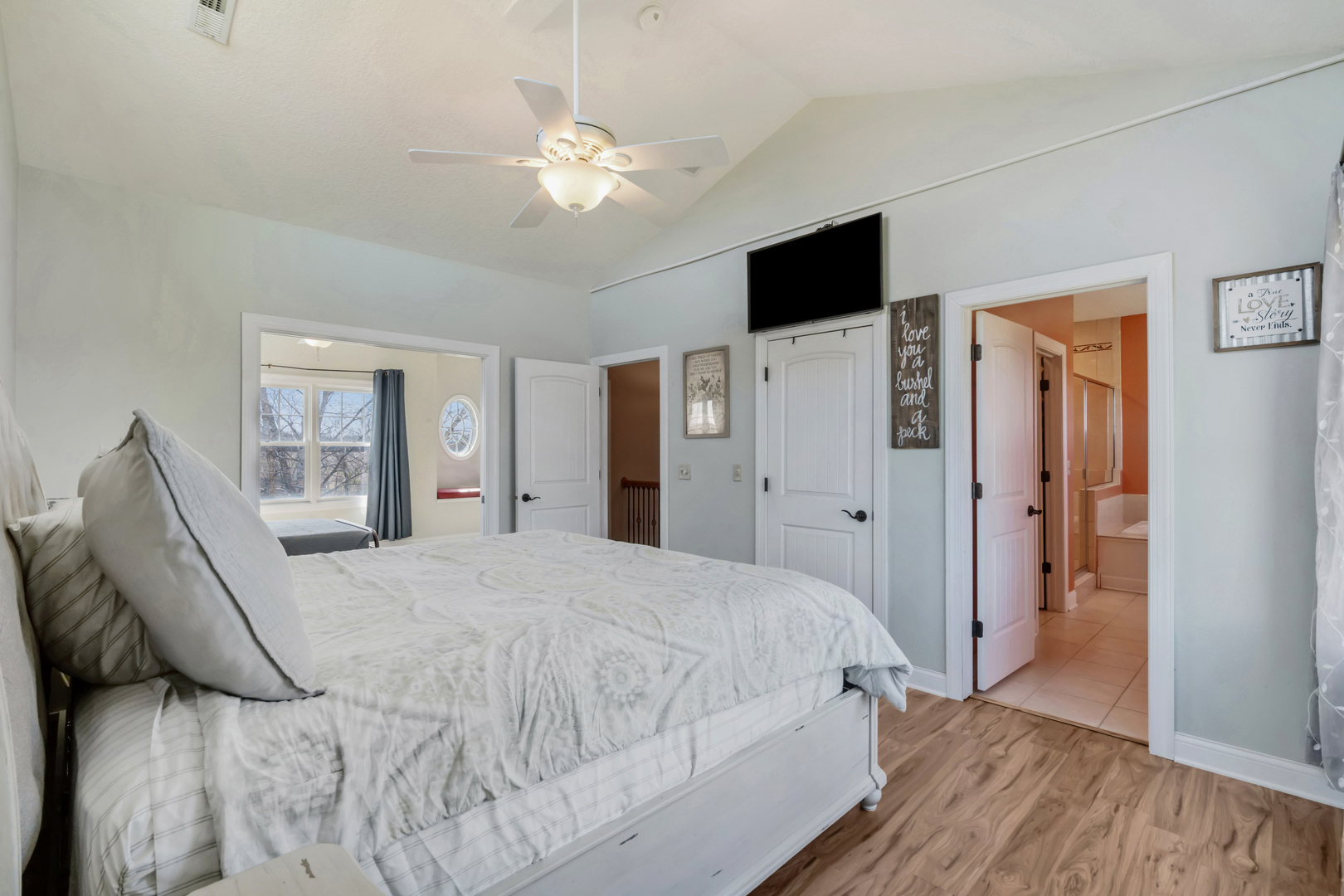 3203 148th Avenue Milan, IL 61264 - Photo 20 of 65 a spacious bedroom with a bed and a flat screen tv