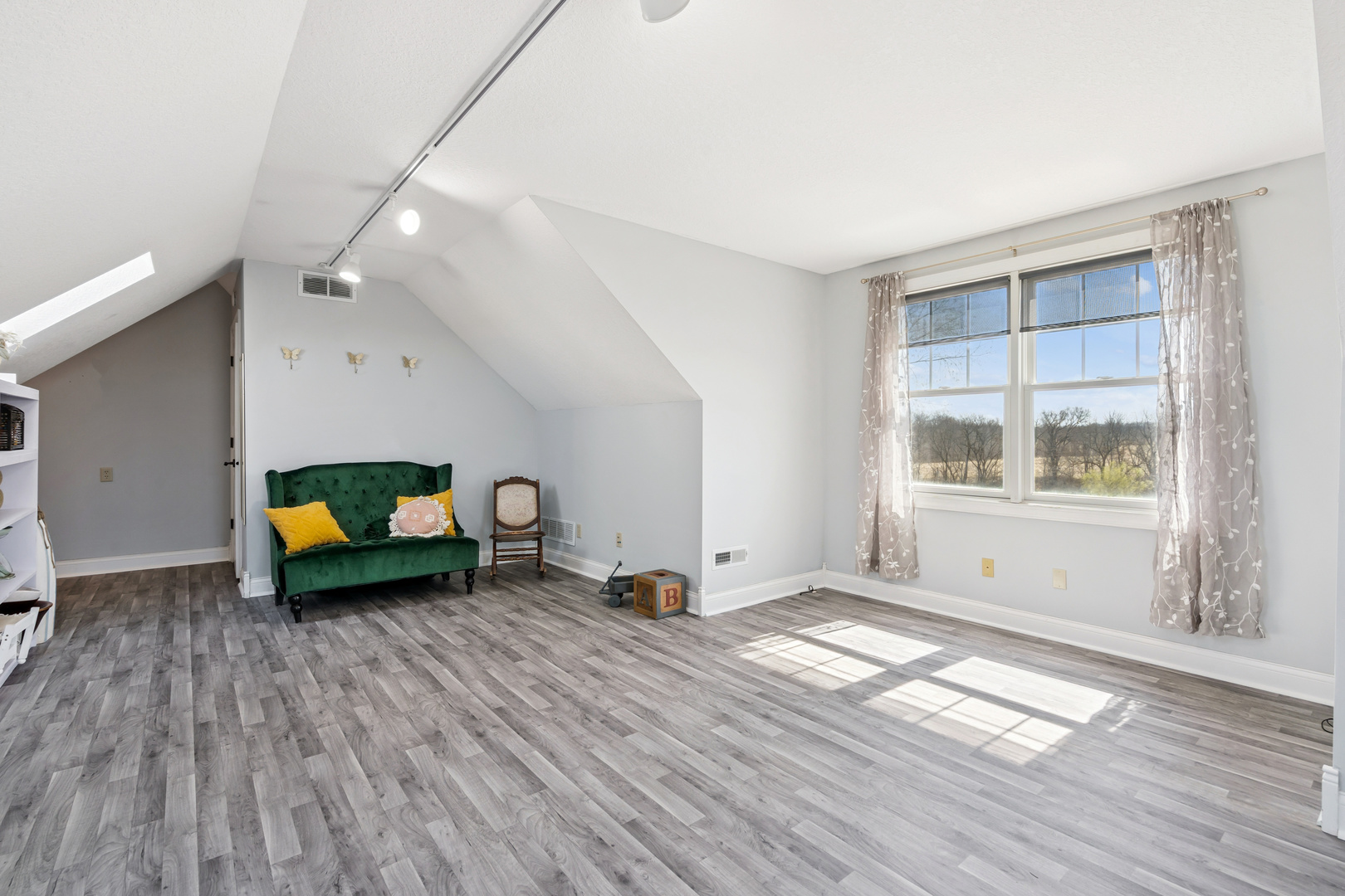 3203 148th Avenue Milan, IL 61264 - Photo 23 of 65 a living room with furniture and a window