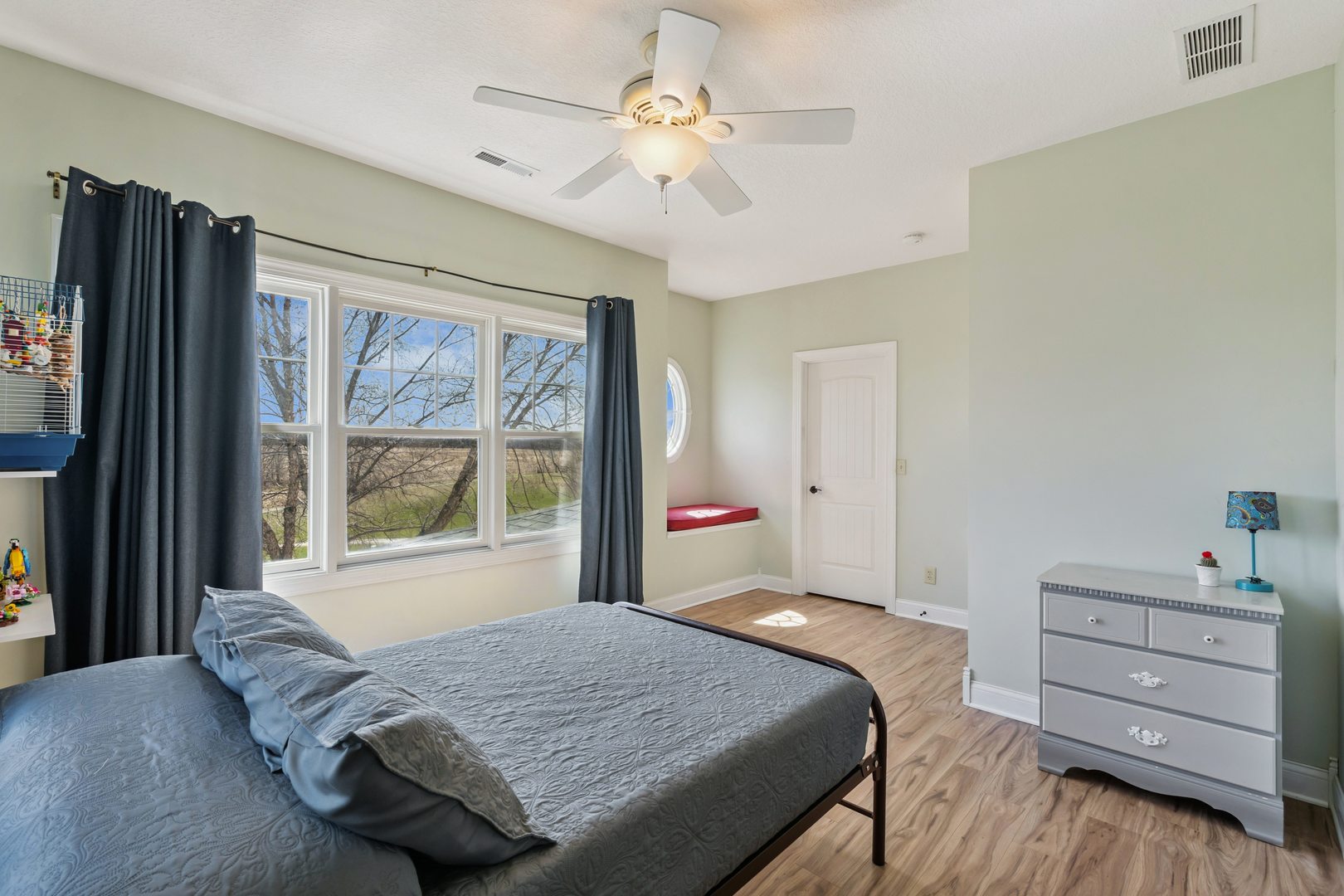 3203 148th Avenue Milan, IL 61264 - Photo 24 of 65 a bedroom with a bed dresser and a window