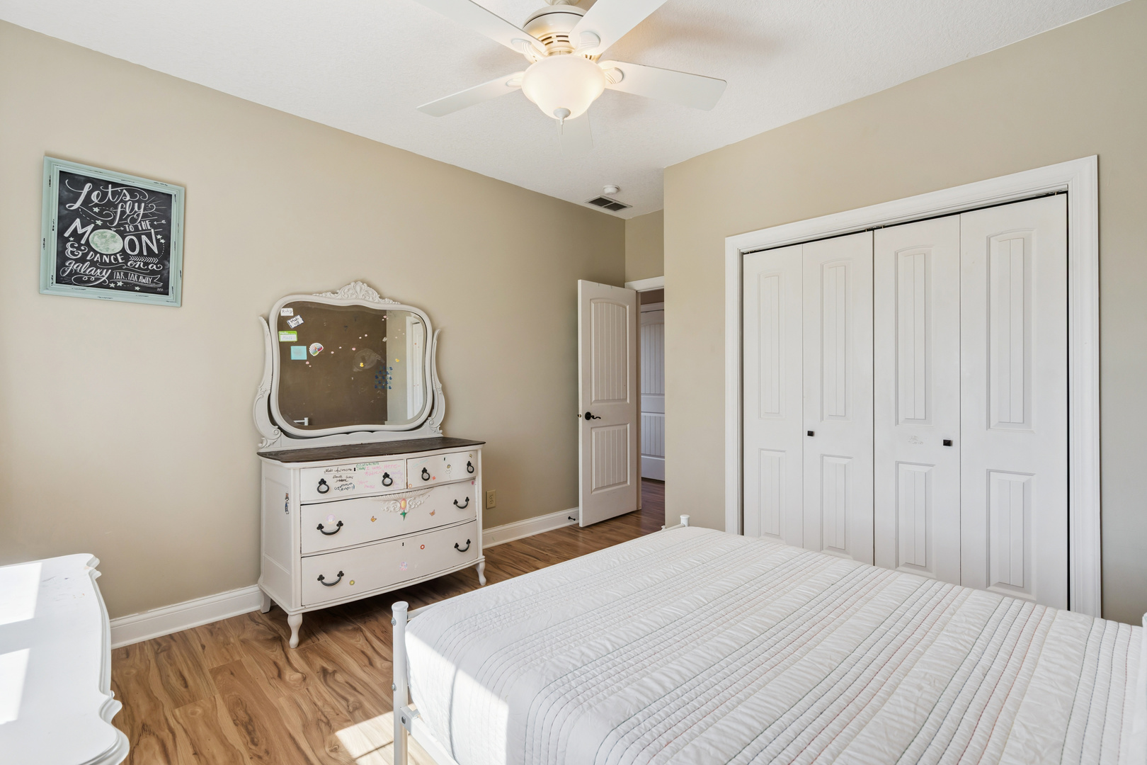 3203 148th Avenue Milan, IL 61264 - Photo 27 of 65 a bedroom with a bed and a dresser