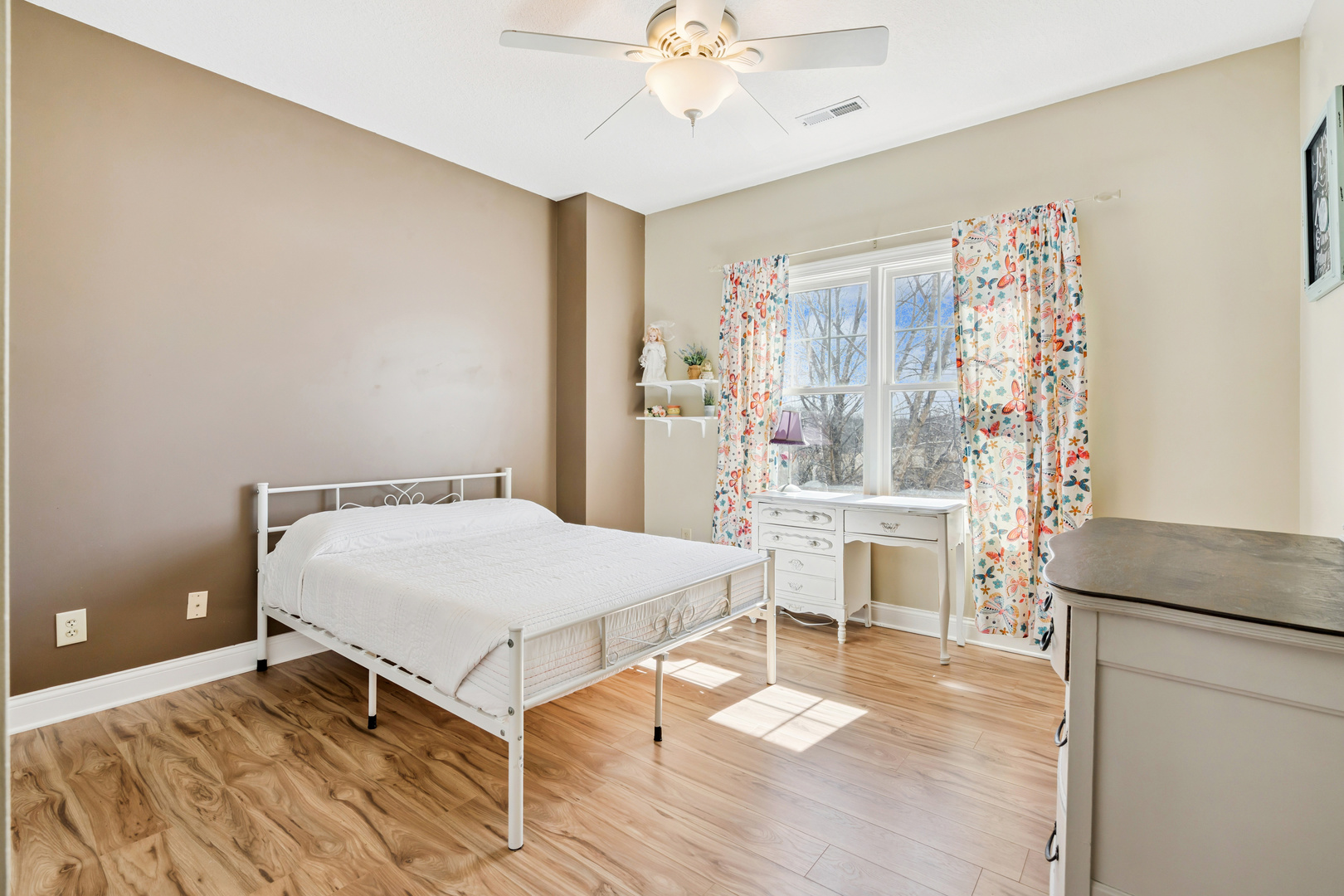 3203 148th Avenue Milan, IL 61264 - Photo 28 of 65 a bedroom with a bed and a table with wooden floor