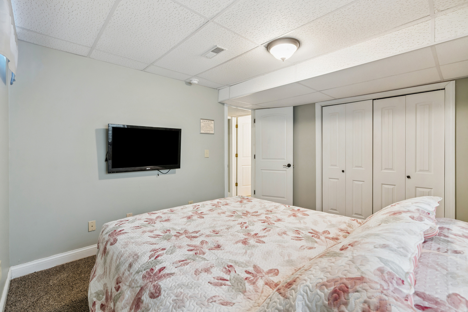 3203 148th Avenue Milan, IL 61264 - Photo 36 of 65 a bedroom with a bed and a flat screen tv