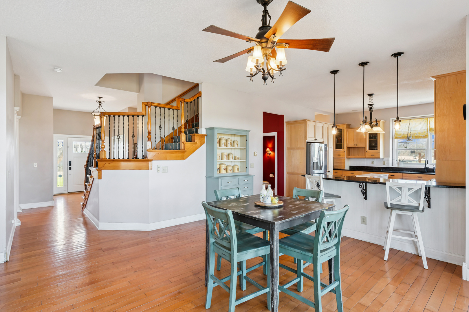 3203 148th Avenue Milan, IL 61264 - Photo 7 of 65 a dining room with furniture a chandelier and wooden floor