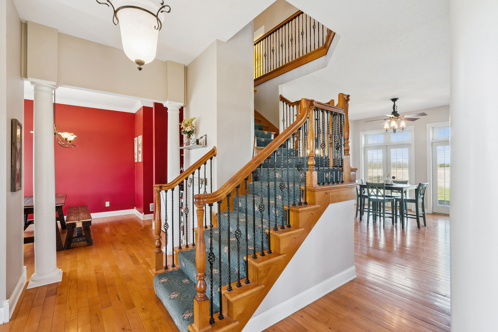 3203 148th Avenue Milan, IL 61264 - Photo 8 of 65 a view of a hallway with wooden floor and staircase
