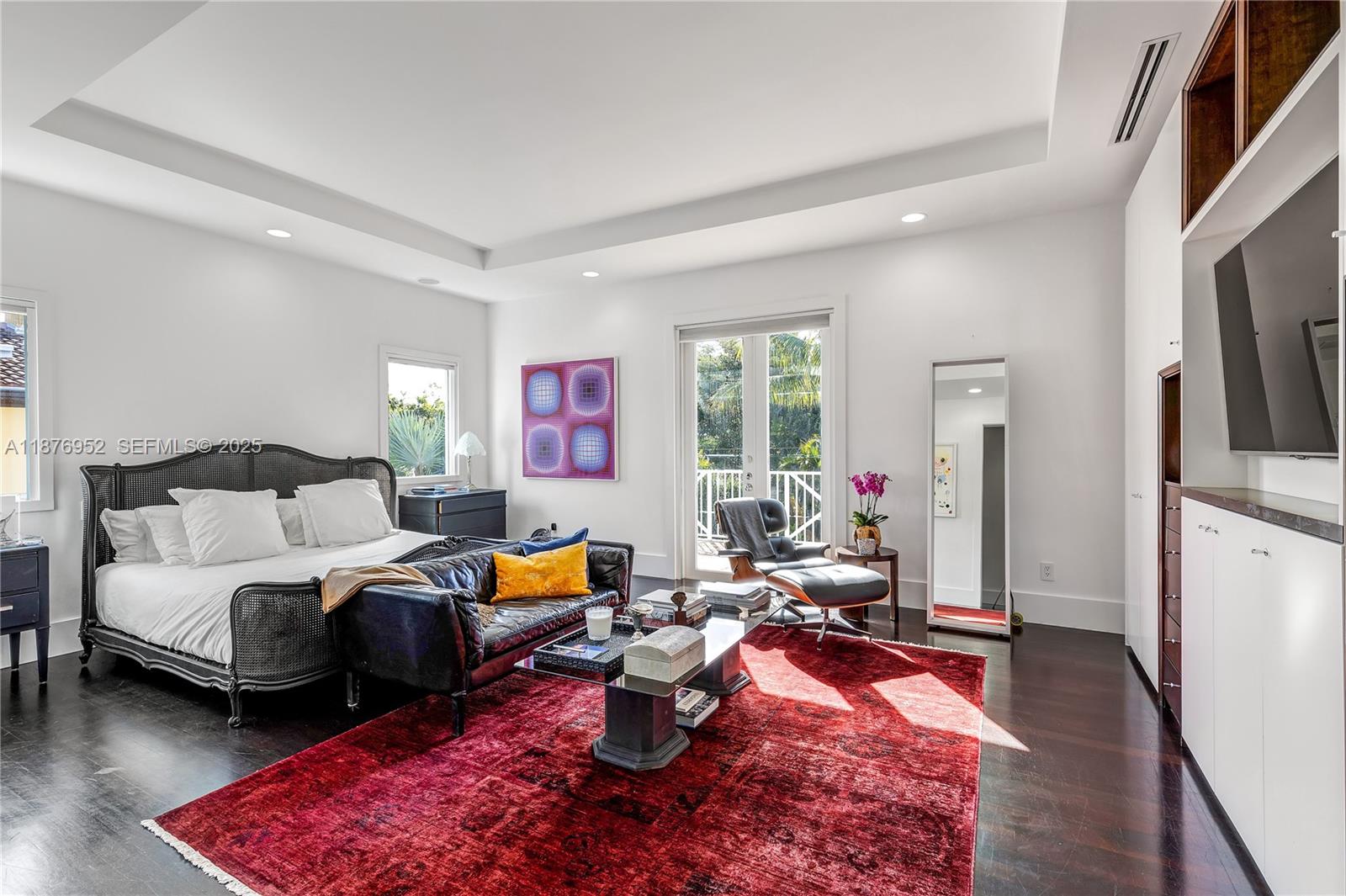 9460 Southwest 69th Avenue Pinecrest, FL 33156 - Photo 21 of 37 a living room with furniture and a flat screen tv