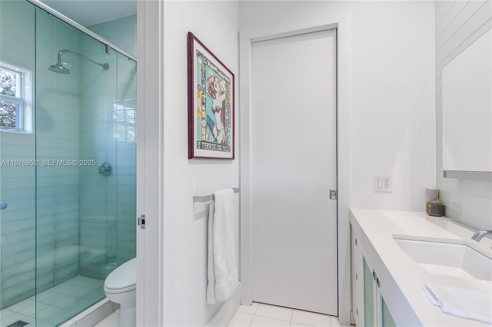 9460 Southwest 69th Avenue Pinecrest, FL 33156 - Photo 30 of 37 a bathroom with a sink a toilet and shower