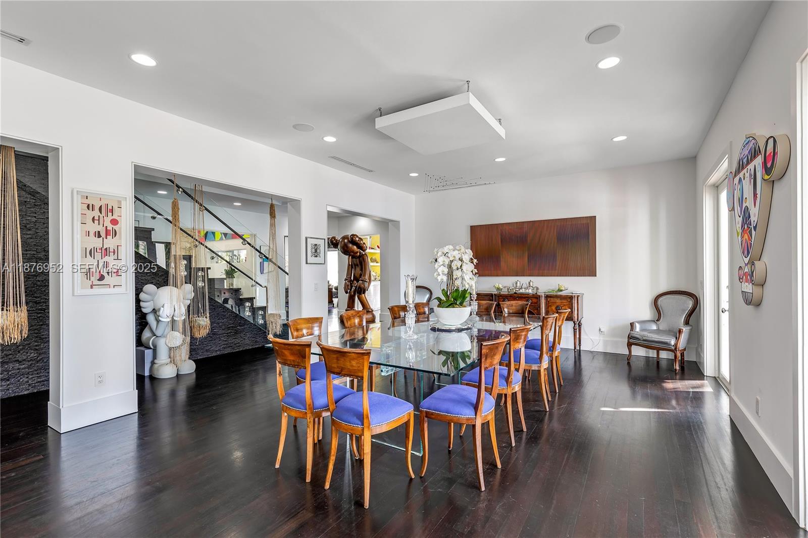 9460 Southwest 69th Avenue Pinecrest, FL 33156 - Photo 7 of 37 a view of a dining room with furniture and wooden floor