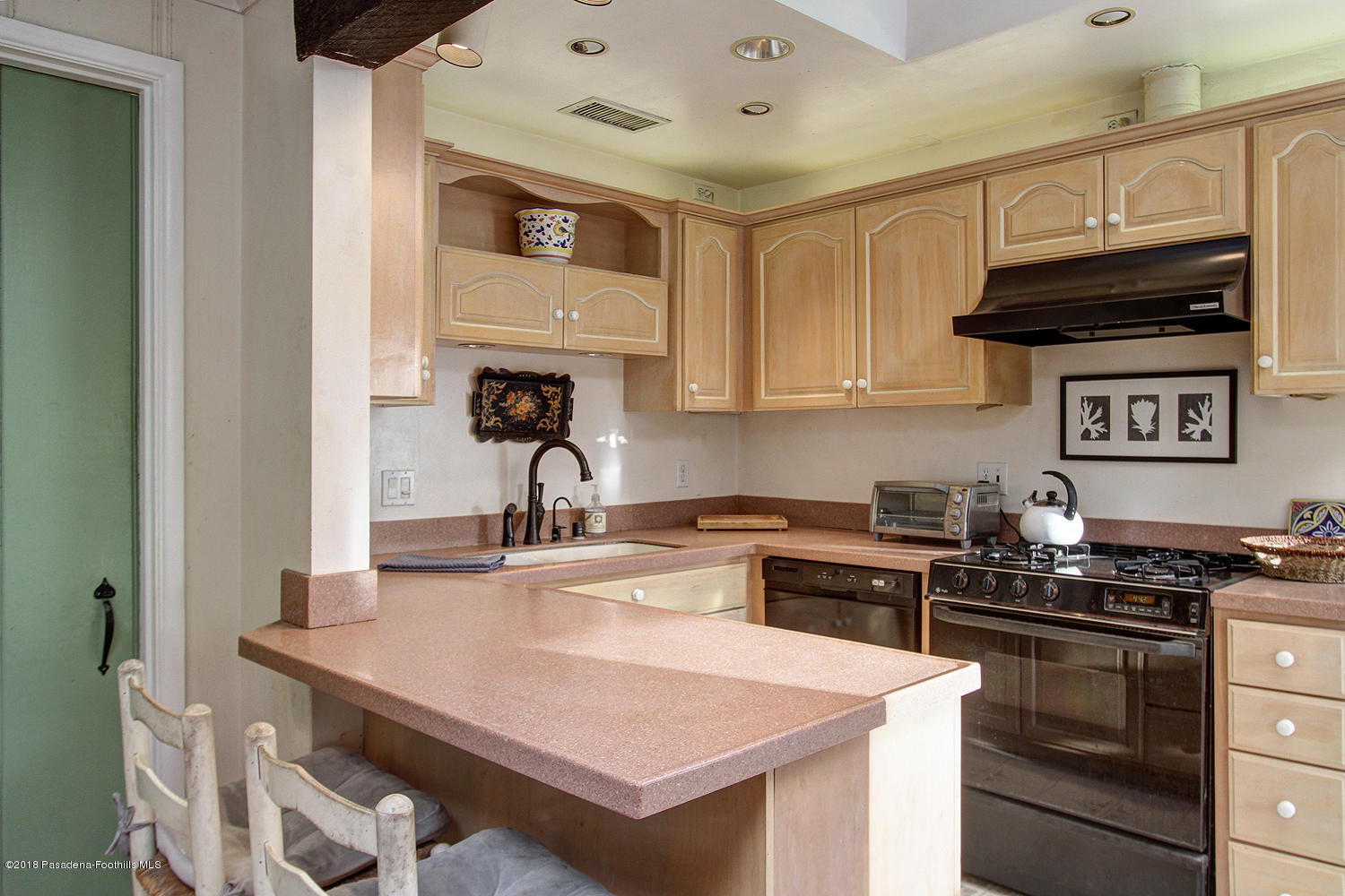 3501 Hollyslope Road Altadena, CA 91001 - Photo 11 of 35 a kitchen with stainless steel appliances granite countertop a stove and a sink