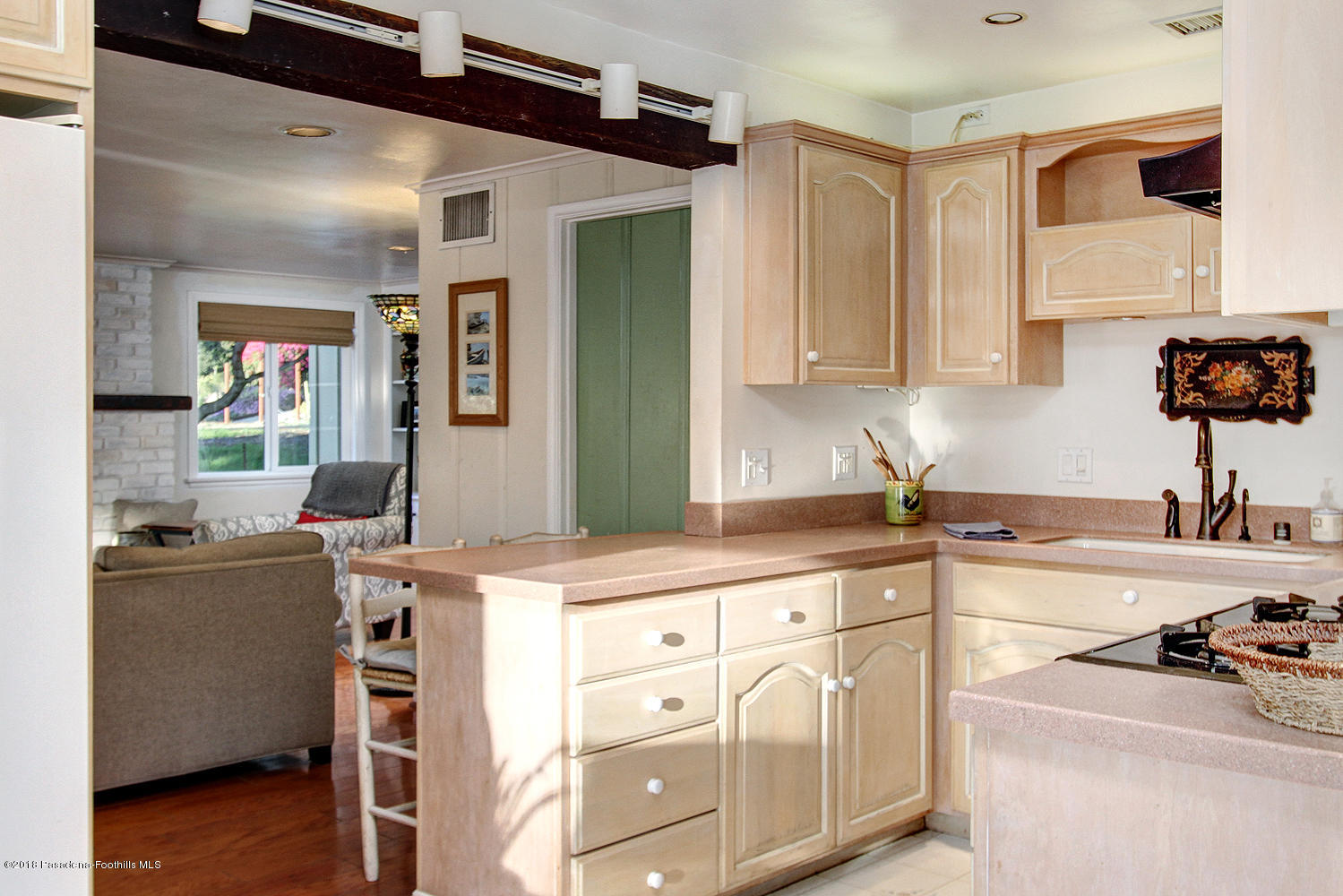 3501 Hollyslope Road Altadena, CA 91001 - Photo 12 of 35 a kitchen with stainless steel appliances granite countertop a sink and cabinets