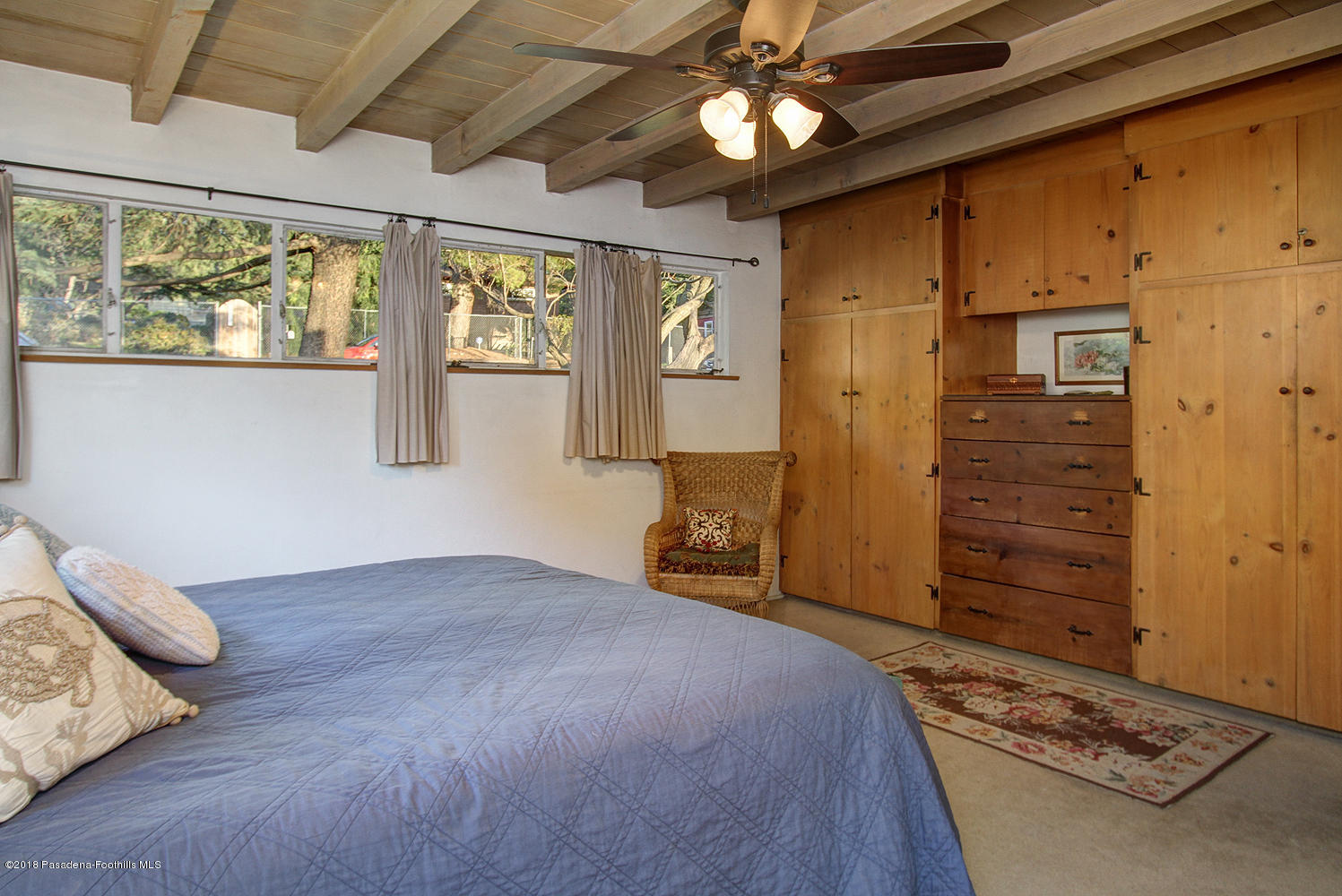 3501 Hollyslope Road Altadena, CA 91001 - Photo 17 of 35 a bedroom with a bed and a ceiling fan