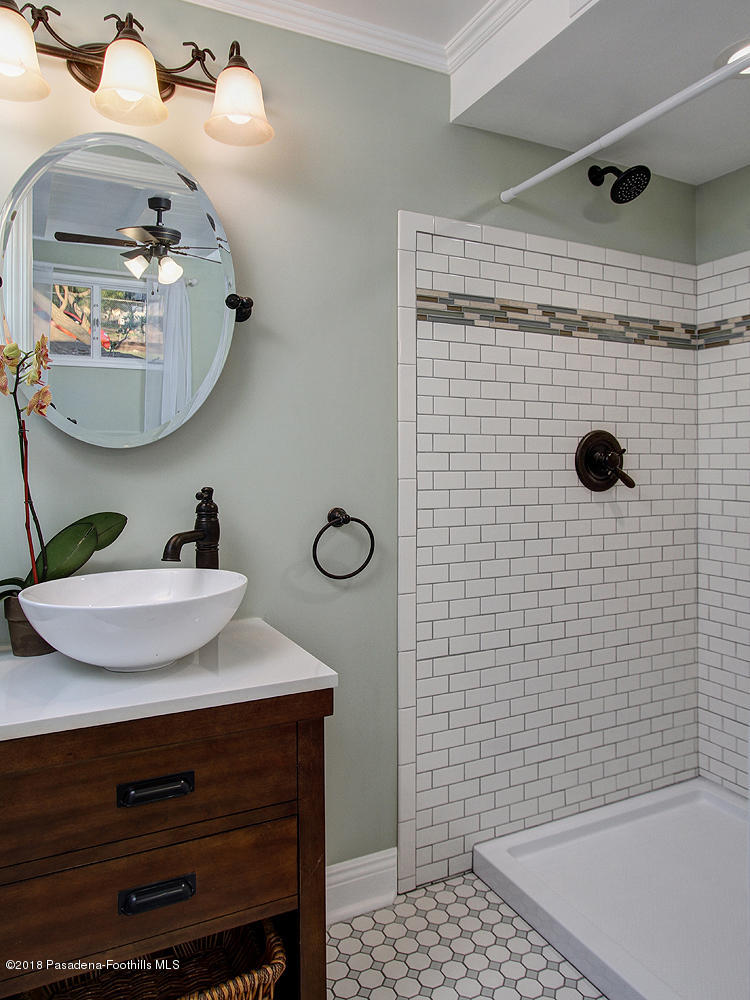 3501 Hollyslope Road Altadena, CA 91001 - Photo 20 of 35 a bathroom with a sink a mirror and shower