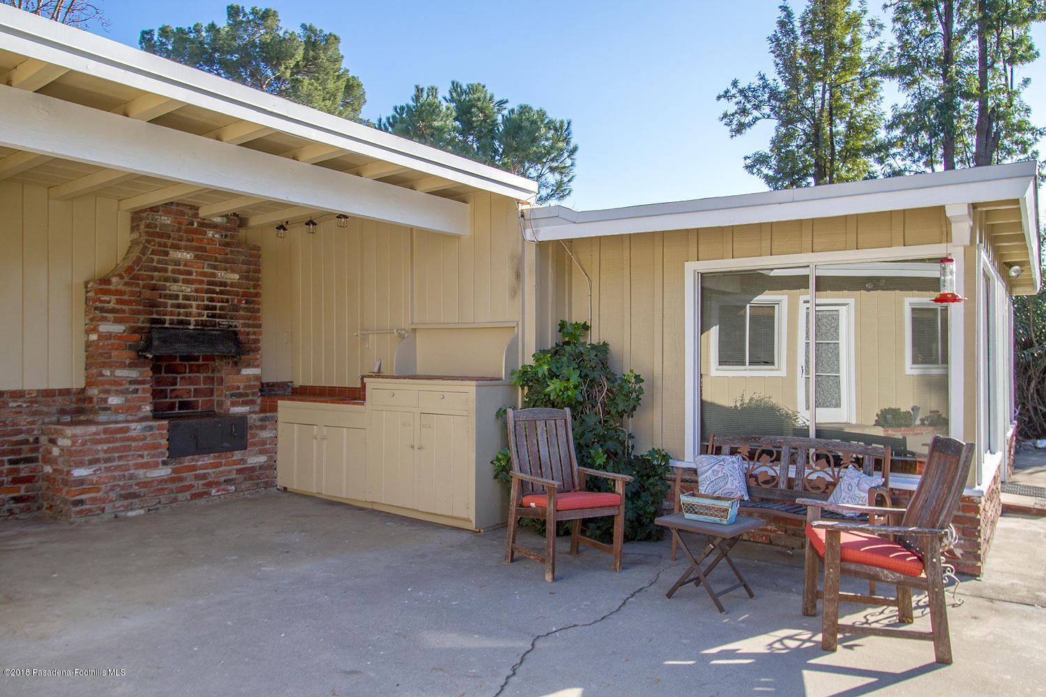 3501 Hollyslope Road Altadena, CA 91001 - Photo 21 of 35 a view of a patio with table and chairs and potted plants