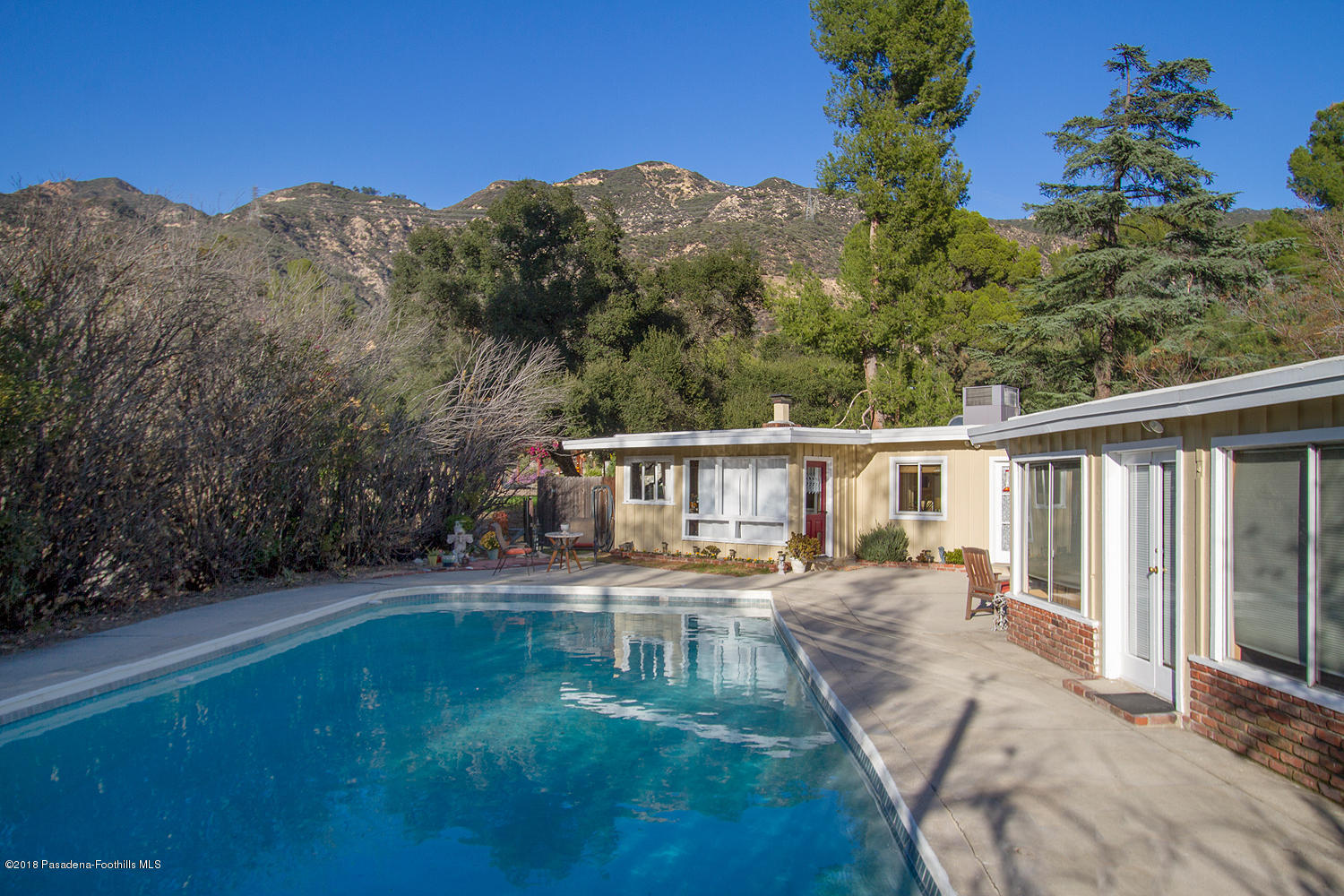3501 Hollyslope Road Altadena, CA 91001 - Photo 22 of 35 a view of a house with backyard and sitting area