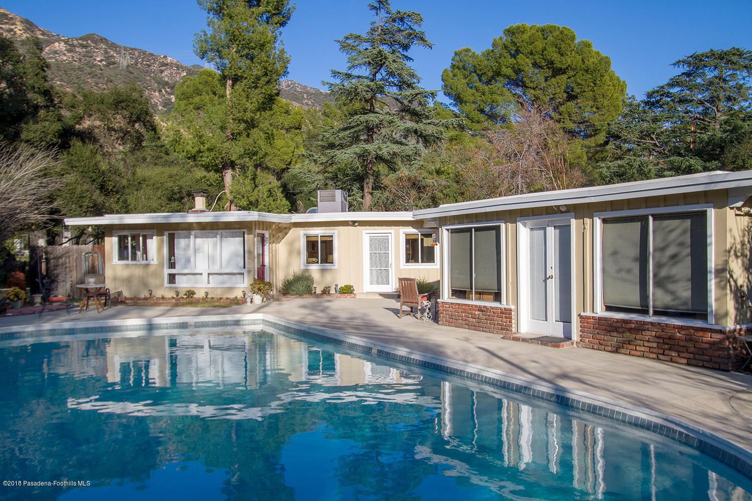 3501 Hollyslope Road Altadena, CA 91001 - Photo 23 of 35 a front view of a house with a yard
