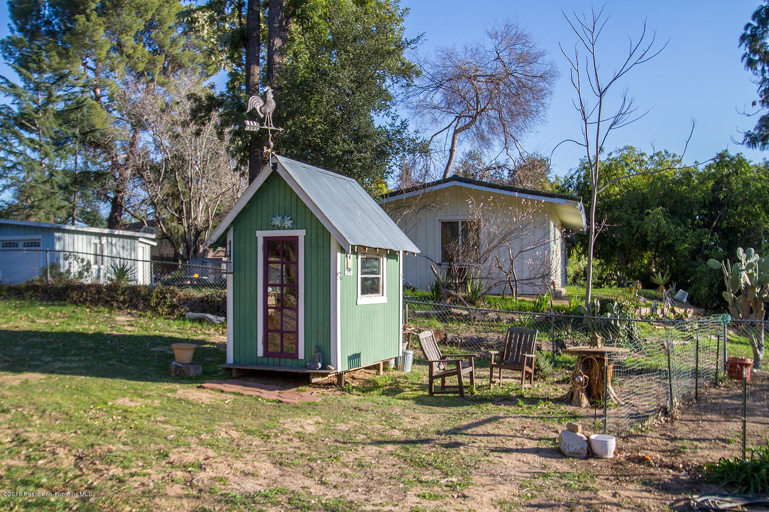 3501 Hollyslope Road Altadena, CA 91001 - Photo 27 of 35 a front view of house with yard and trees in the background