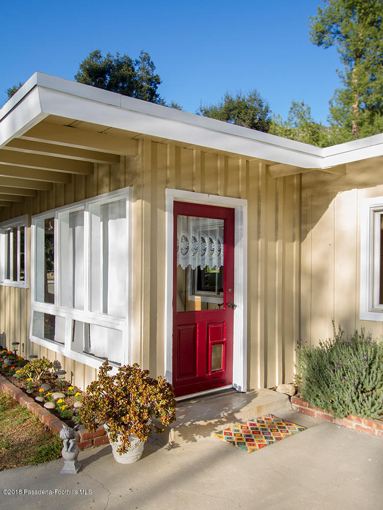 3501 Hollyslope Road Altadena, CA 91001 - Photo 5 of 35 a front view of a house with a garage