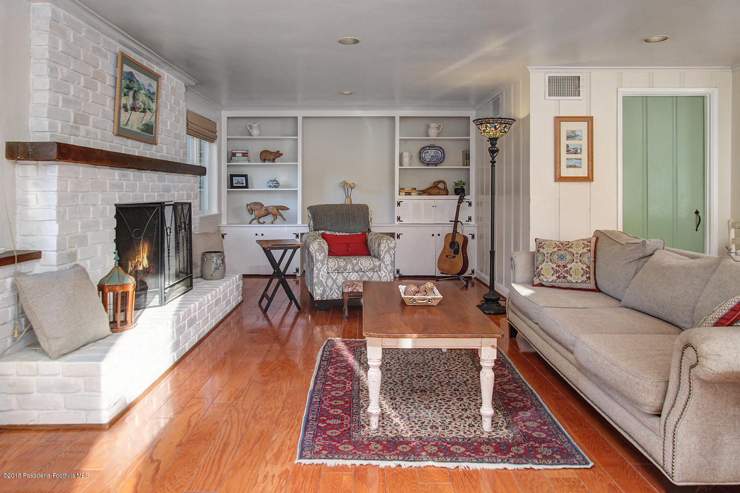 3501 Hollyslope Road Altadena, CA 91001 - Photo 8 of 35 a living room with furniture and a fireplace