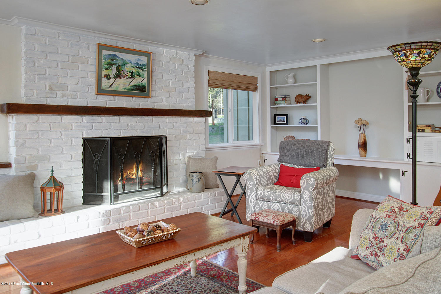 3501 Hollyslope Road Altadena, CA 91001 - Photo 9 of 35 a living room with furniture and a fireplace