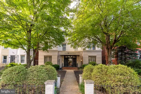 front view of a house with a garden