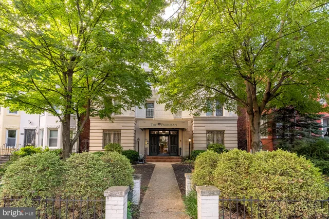 front view of a house with a garden
