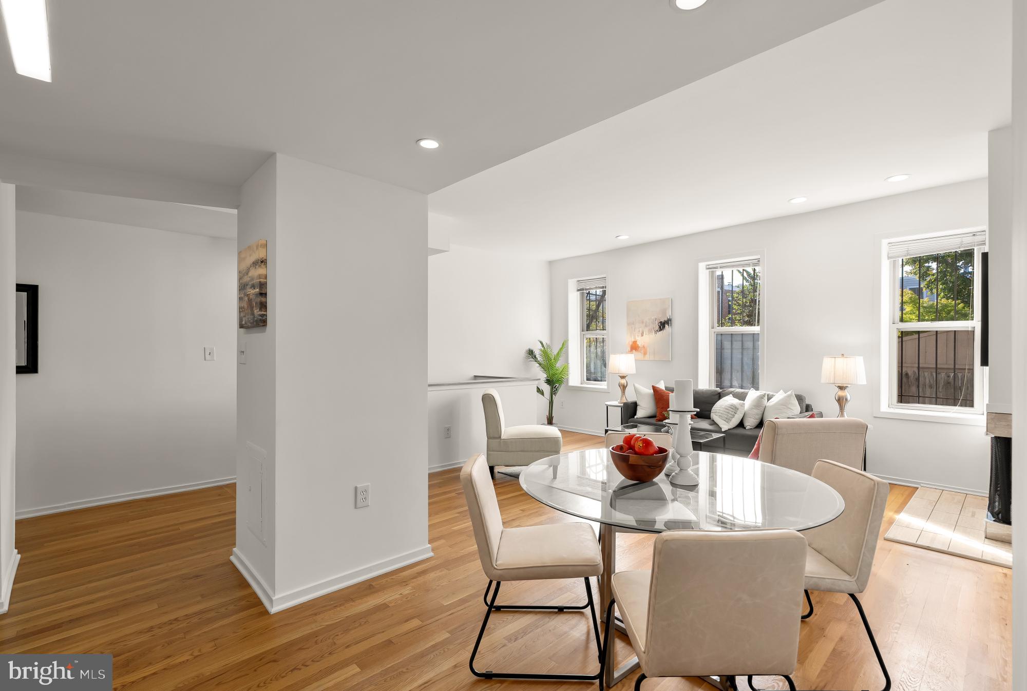1341 East Capitol Street Southeast, Unit 107 Washington, DC 20003 - Photo 5 of 15 a dining room with furniture window and wooden floor