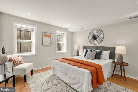 a bedroom with bed and a window