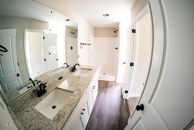 125 Wilson Street Erwin, NC 28339 - Photo 14 of 22 a bathroom with a tub sink and mirror