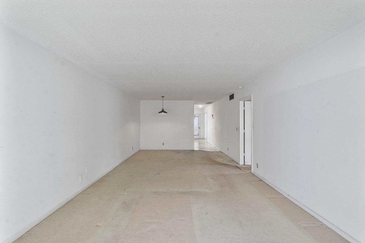 1141 Violet Terrace, Unit 101 Delray Beach, FL 33445 - Photo 6 of 20 Living room to Dining area