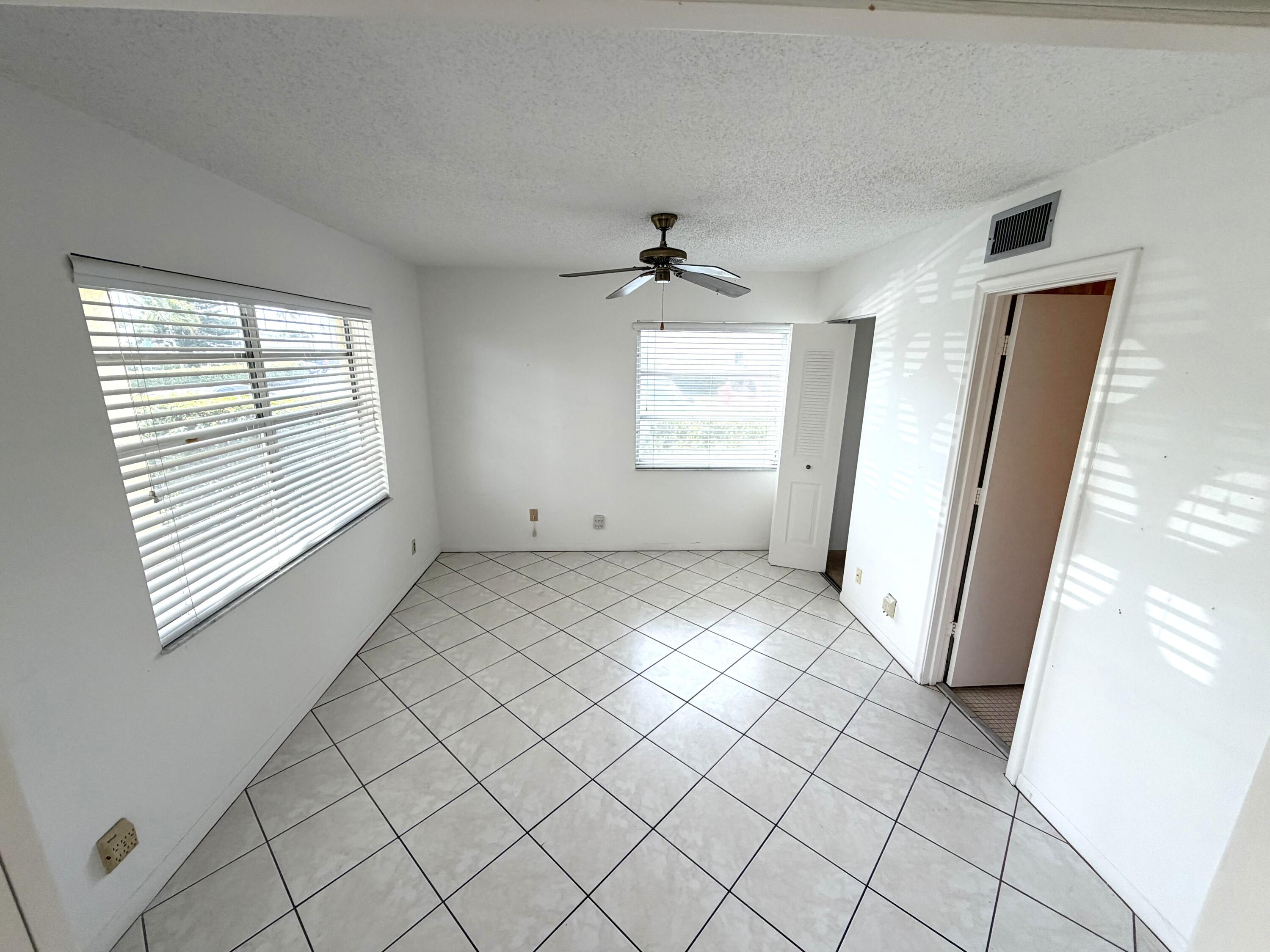 1141 Violet Terrace, Unit 101 Delray Beach, FL 33445 - Photo 7 of 20 Guest bedroom