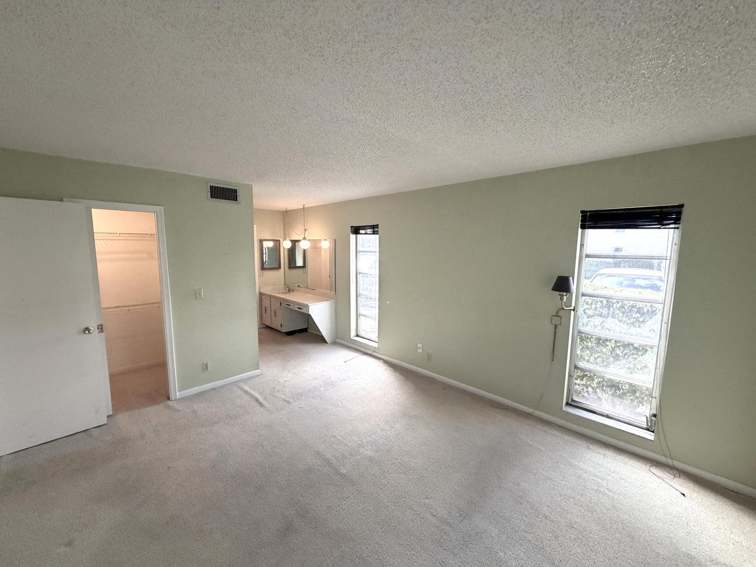 1141 Violet Terrace, Unit 101 Delray Beach, FL 33445 - Photo 10 of 20 Master bedroom